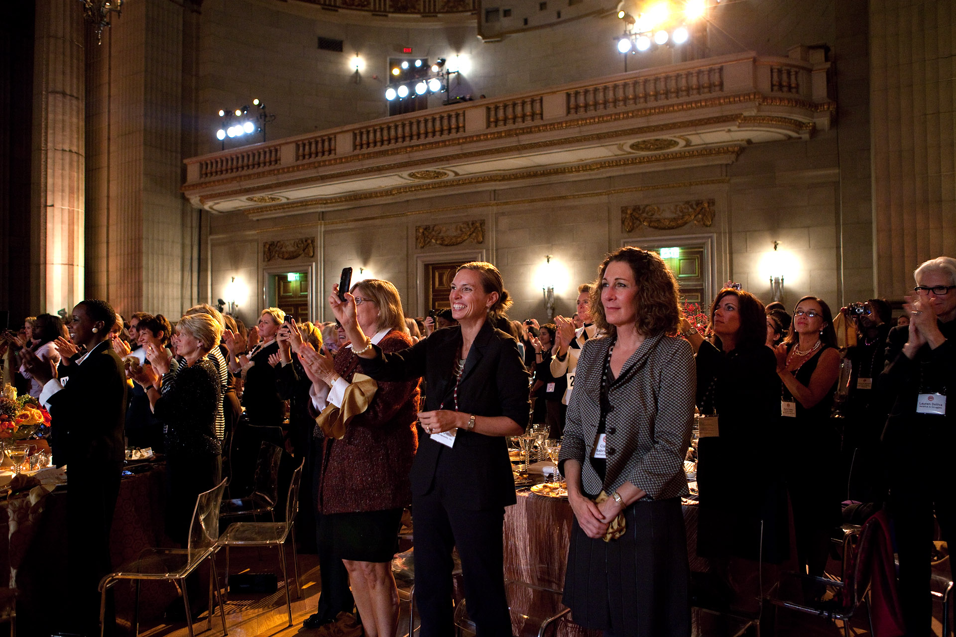 Members of the Audience Stand and Applaud as President Barack Obama Arrives to Address the 2010 Fortune Most Powerful Women Summit 