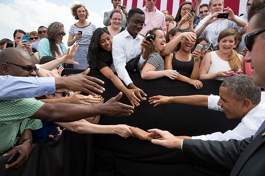 President Barack Obama greets audience members after he delivers remarks on the economy at the Georgetown Waterfront Park