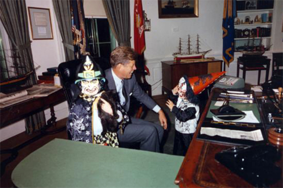 Caroline and John Jr. visit President Kennedy in the Oval Office on Halloween