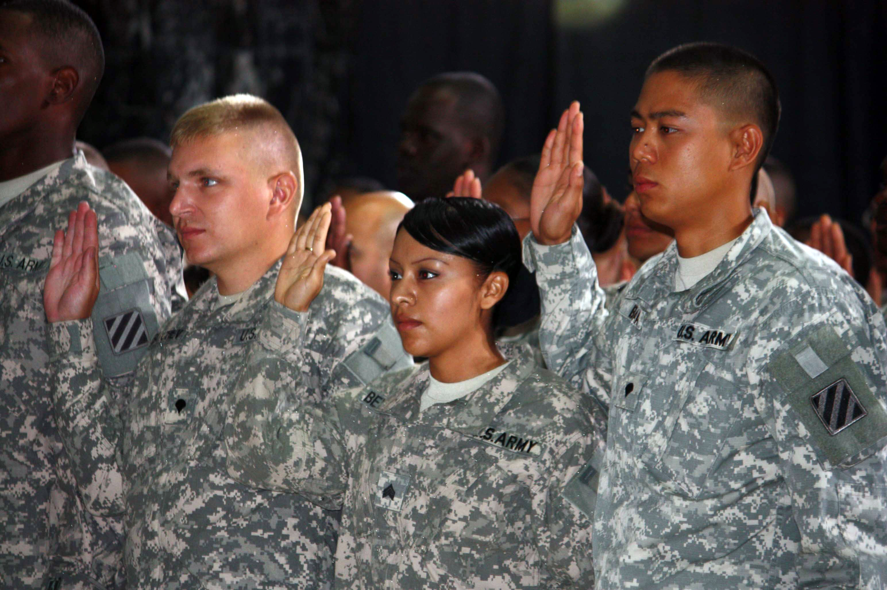 U.S. troops take the citizenship oath during a naturalization ceremony