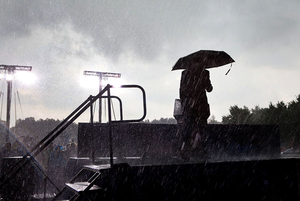 President Obama Takes Stage on Memorial Day During Rain