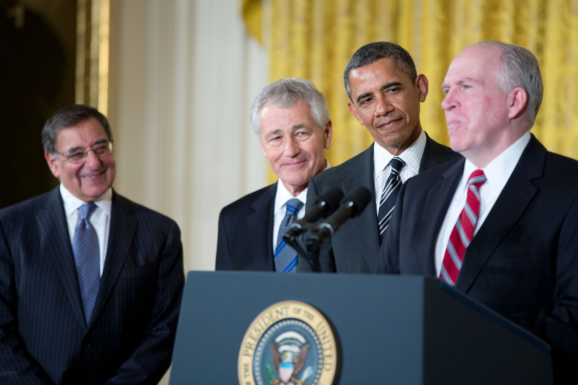 President Barack Obama listens to the remarks of John Brennan