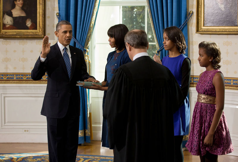 Supreme Court Chief Justice John Roberts administers the oath of office to President Barack Obama