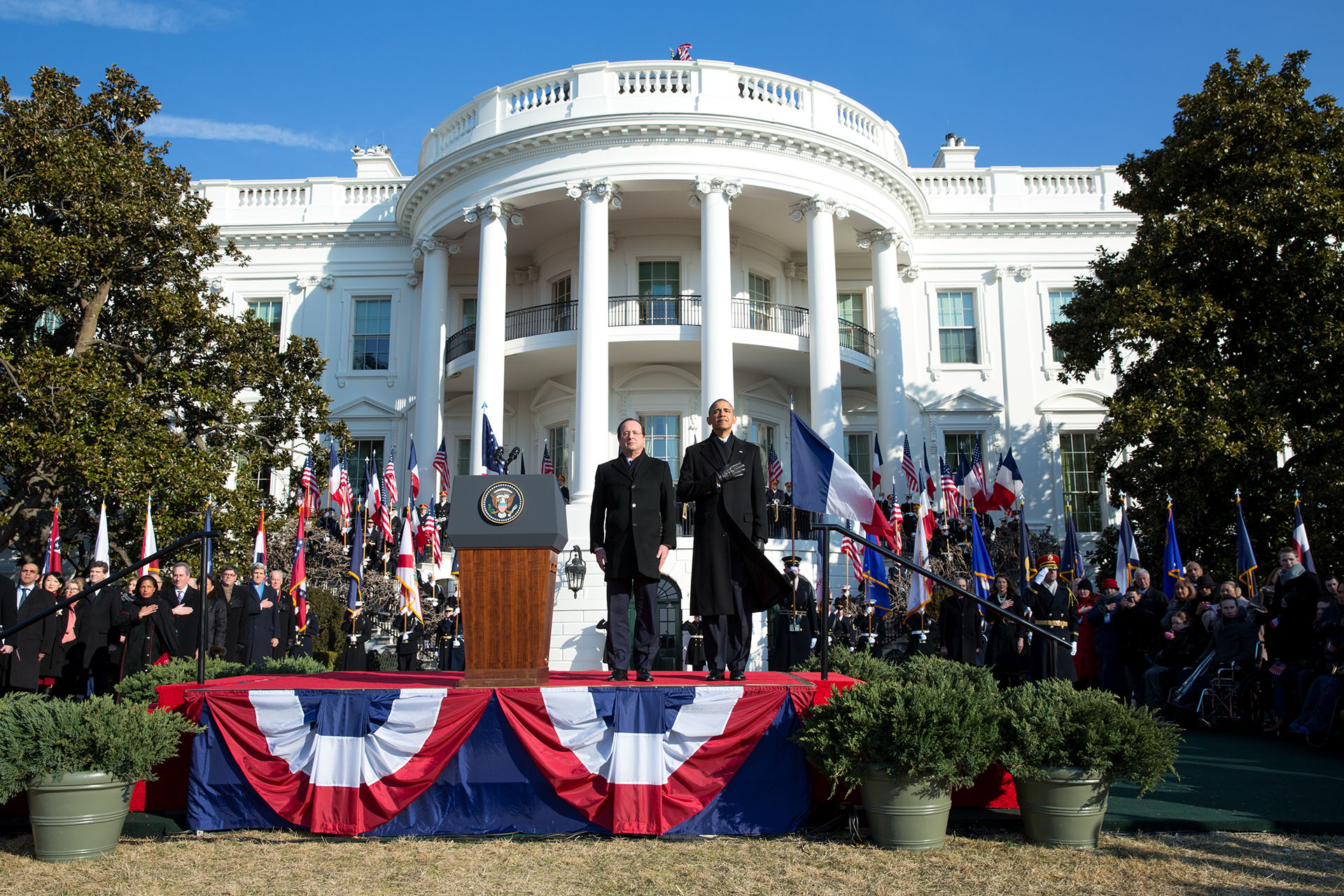 President Barack Obama and President François Hollande of France listen to the French and U.S. national anthems during the state arrival ceremony