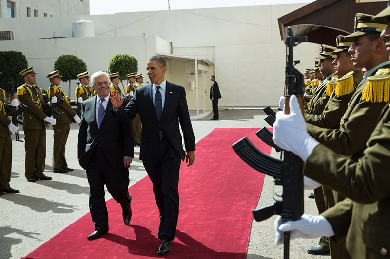 President Barack Obama and President Mahmoud Abbas of the Palestinian Authority walk past an honor guard