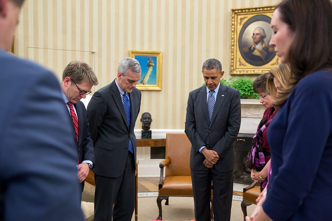 President Barack Obama, with senior advisors observes a moment of silence at 2:49 P.M. to mark the one-year anniversary since the Boston Marathon bombings