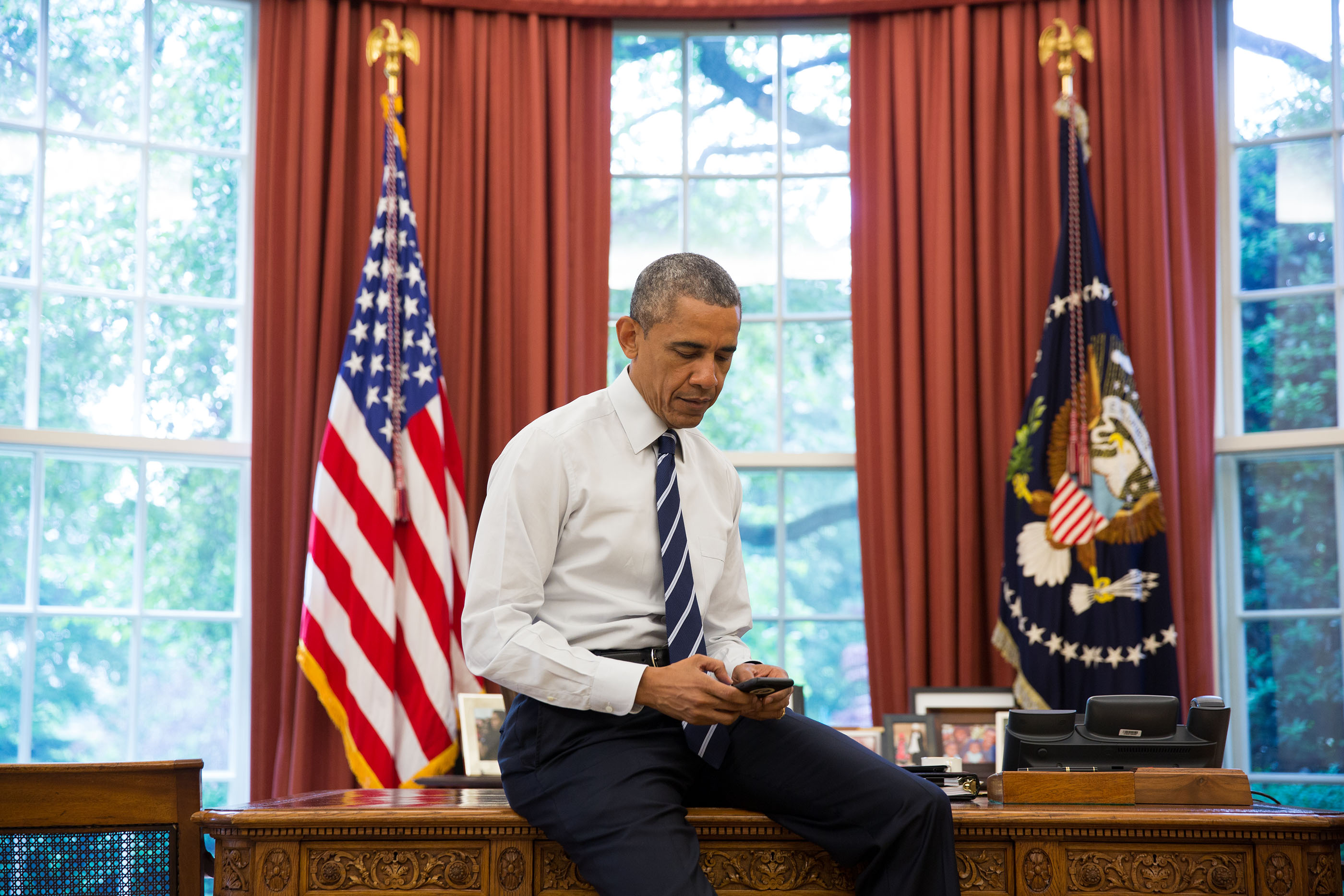 President Barack Obama tweets his first tweet from his new @POTUS account from the Oval Office