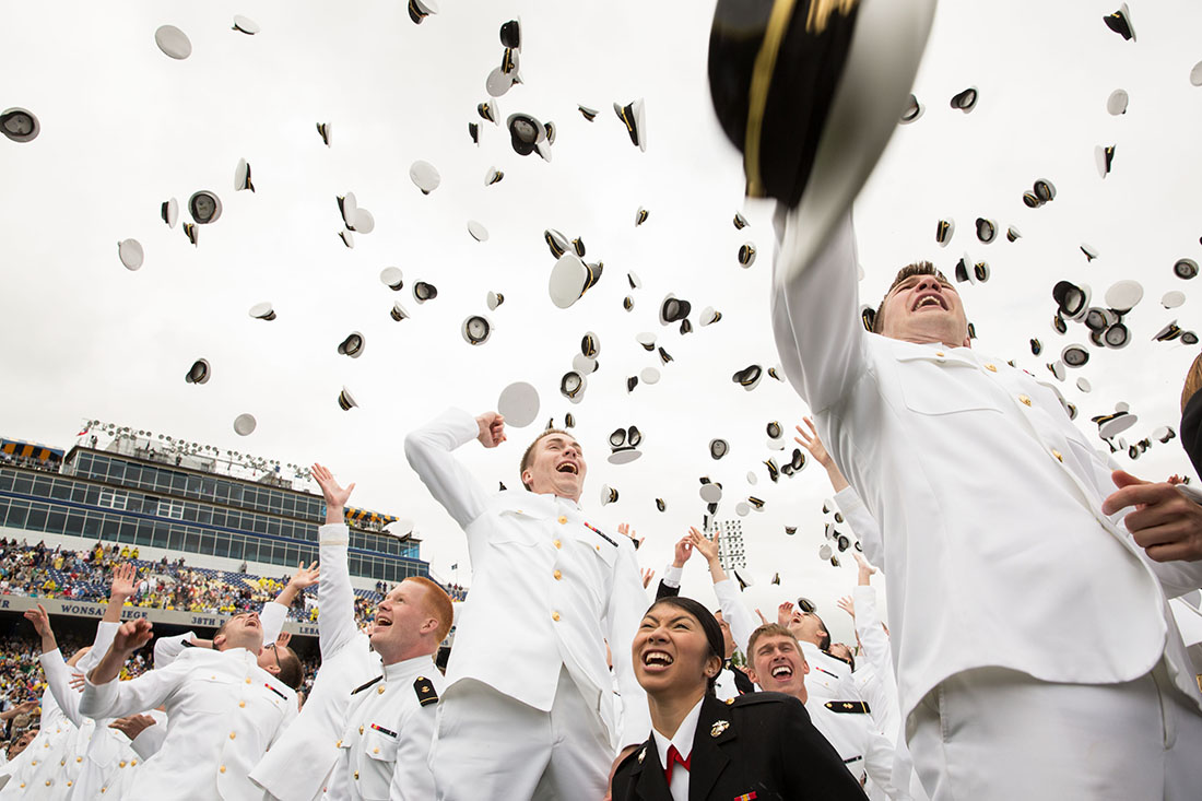 Graduates toss hats in the air at conclusion of U.S. Naval Academy commencement