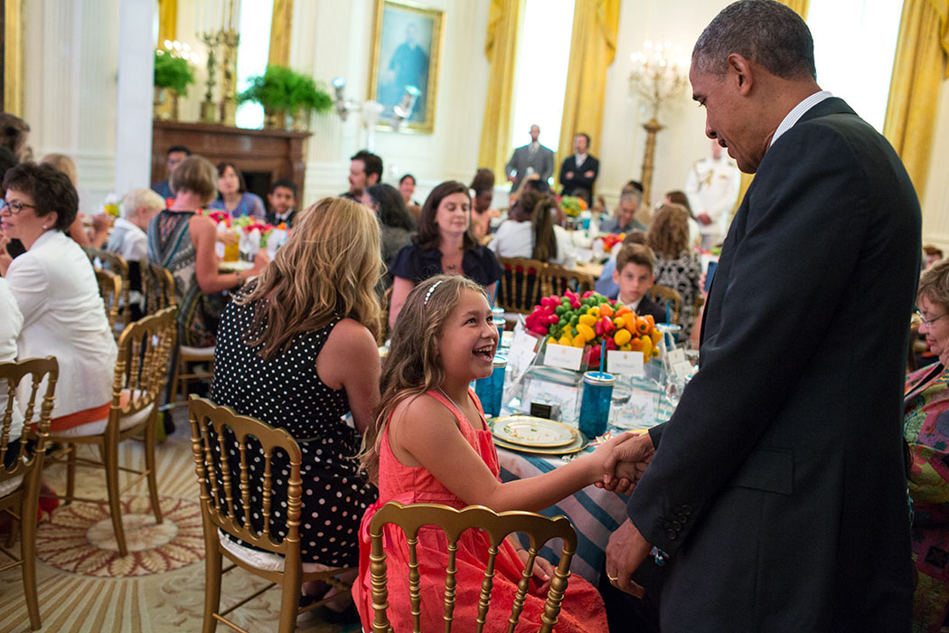 President Barack Obama greets guests at the Kids' State Dinner 2013