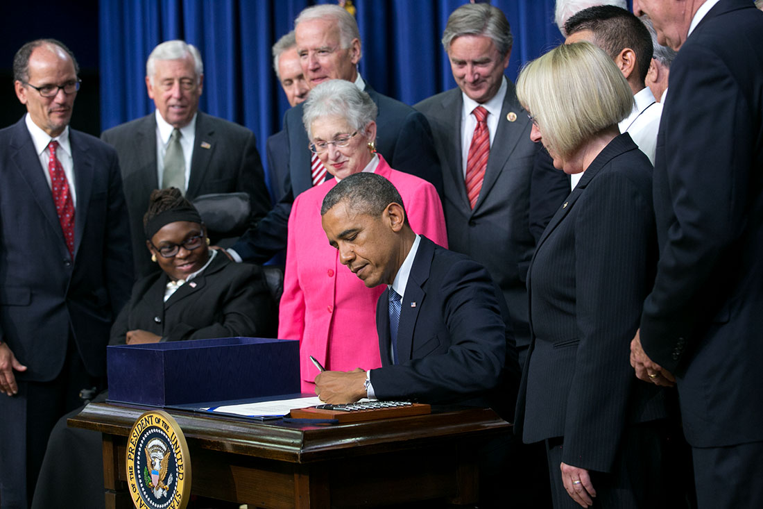 President Barack Obama signs H.R. 803