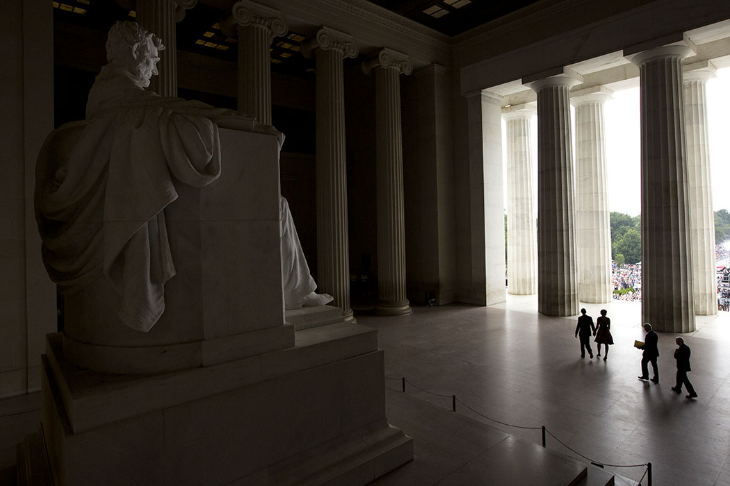 President Barack Obama walks past the statue of President Lincoln