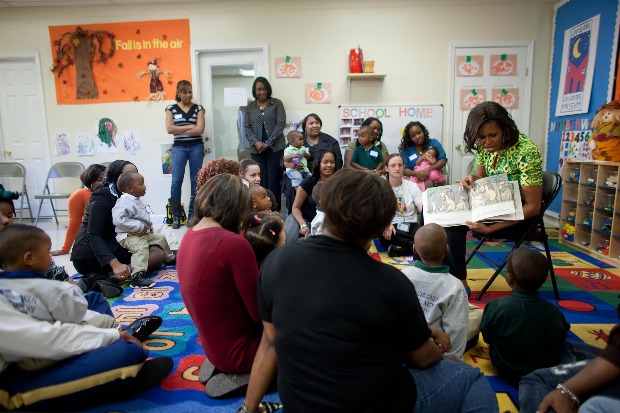 First Lady Michelle Obama reads to children at the Royal Castle Child Development Center 