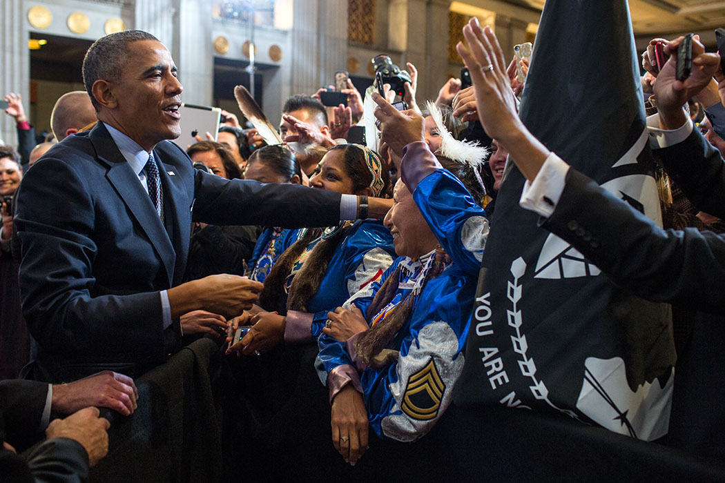 President Barack Obama greets audience members after remarks during the 2013 Tribal Nations Conference at the Department of the Interior in Washington, D.C