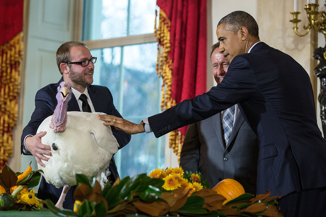 President Barack Obama, National Turkey Federation Chairman Gary Cooper; and son Cole Cooper participate in the annual National Thanksgiving Turkey pardon ceremony in the Grand Foyer of the White House, Nov. 26, 2014.