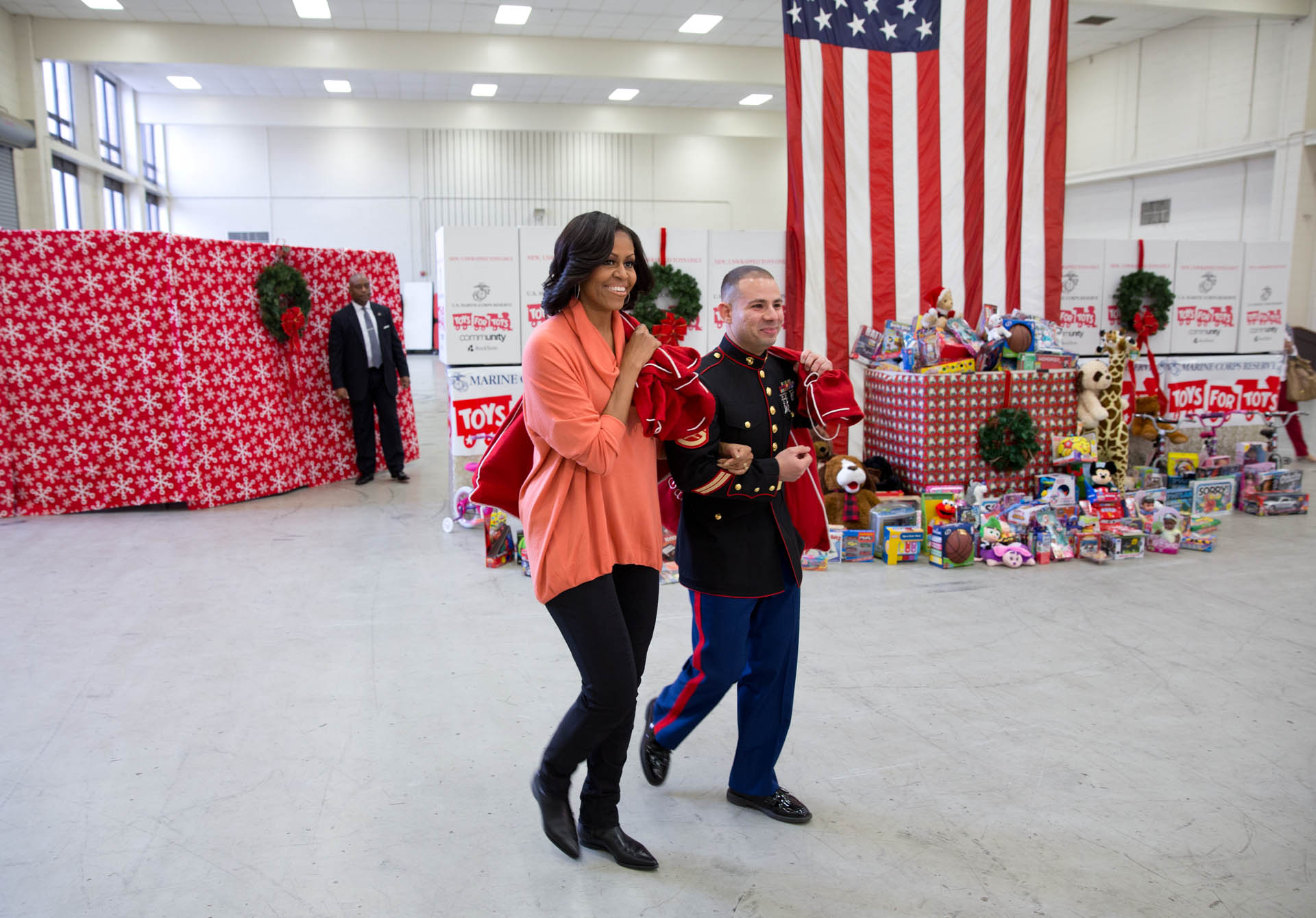 First Lady Michelle Obama Brings a sack full of toys to Toys for Tots, Dec. 11, 2012