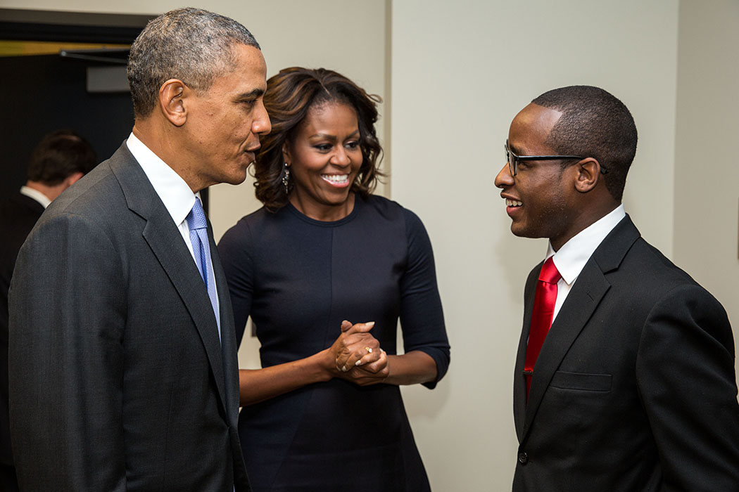 President Barack Obama and First Lady Michelle Obama greet Troy Simon