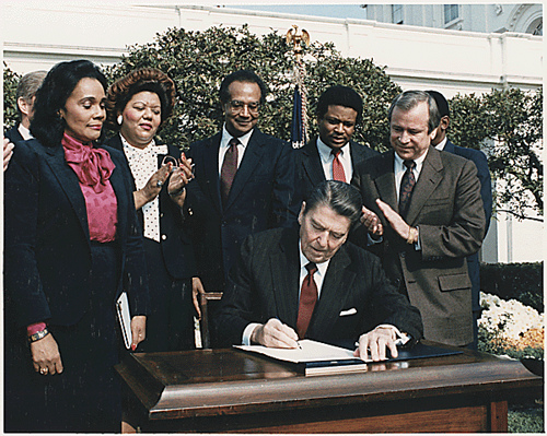 Reagan signs MLK Day legislation
