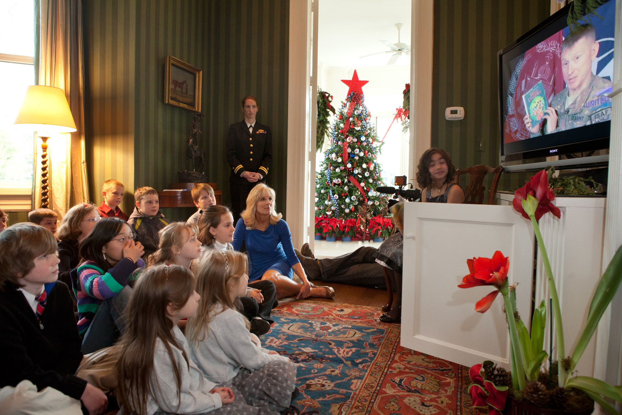 Students listen to Major James Blain read Mickey’s Christmas Carol.
