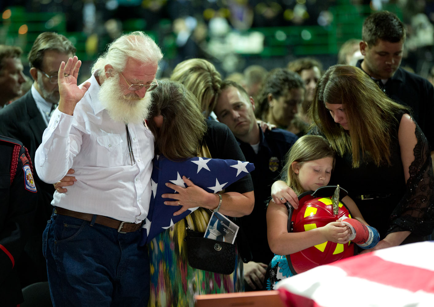 Family members react during a memorial service at Baylor University
