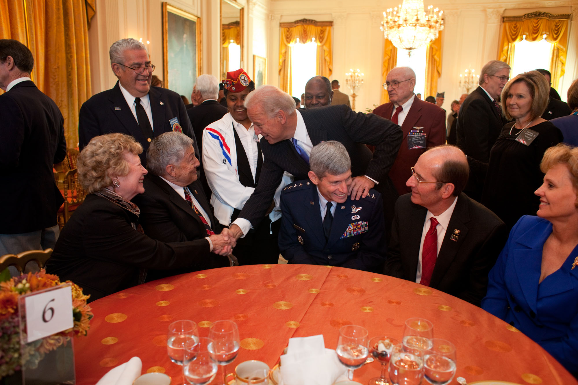 Vice President Joe Biden Leans Over Chief of Staff of the Airforce General Schwartz at the Veterans Day Breakfast