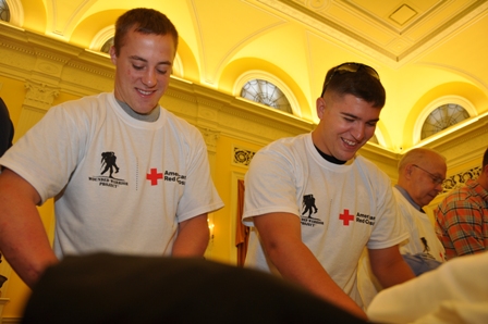 Volunteers putting together Transitional Care Packages