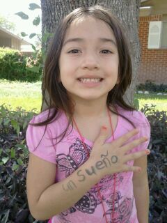 My niece with the word Dream written on her arm