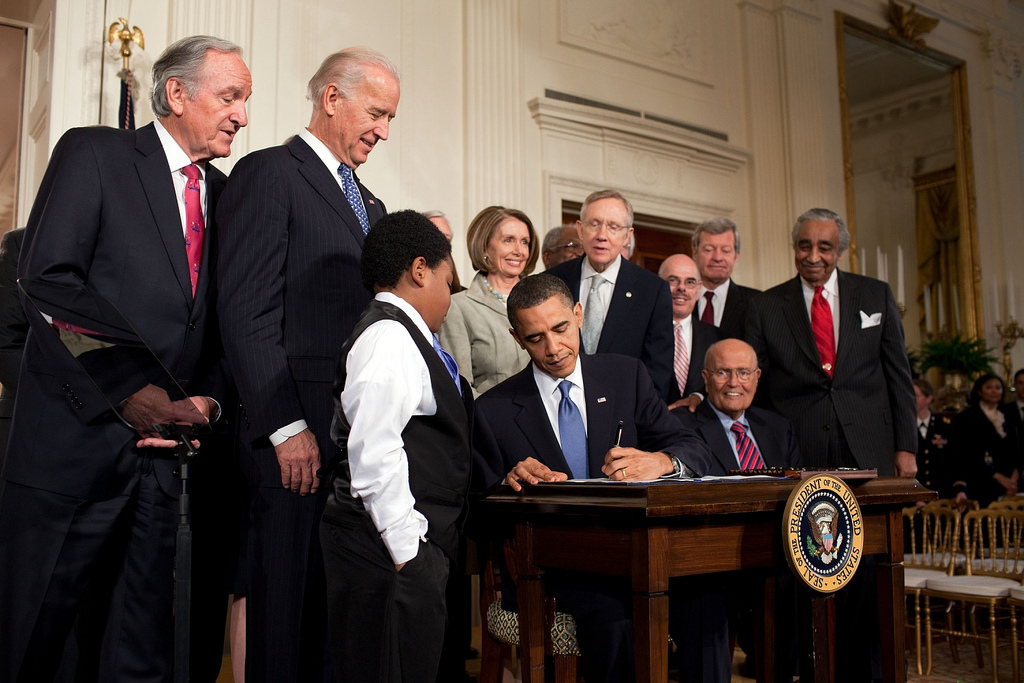 Obama signs health care bill in the White House
