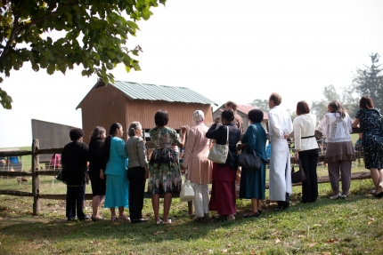 First Lady Michelle Obama and spouses learn how chickens have been raised 