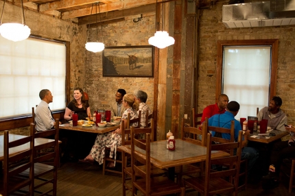 President Barack Obama has lunch and talks with local residents at Stubb’s BBQ