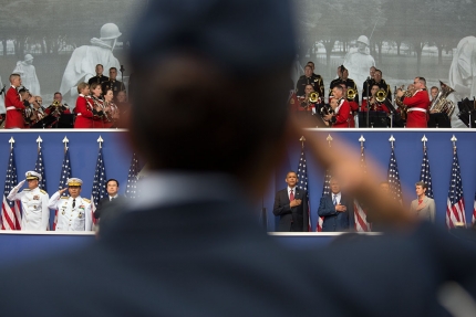 A veteran salutes during the the ceremony to commemorate the 60th anniversary of the signing of the Armistice