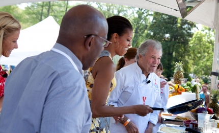 First Lady Michelle Obama participates in the "Play With Your Food" station with Jacque Pepin