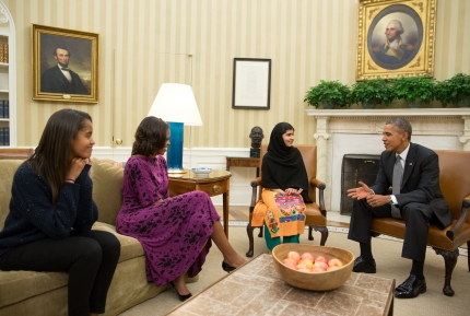 President Barack Obama, First Lady Michelle Obama, and their daughter Malia meet with Malala Yousafzai