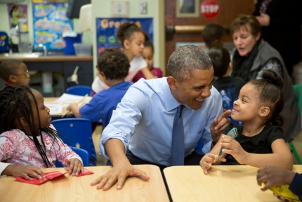 President Obama plays with children at Child Center