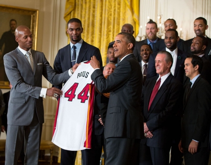LeBron James, Chris Bosh and Dwyane Wade present President Barack Obama with a basketball and a jersey