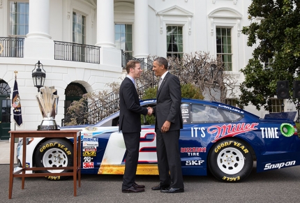 President Barack Obama talks with Brad Keselowski in front of his car during an event celebrating his NASCAR Sprint Cup Series championship
