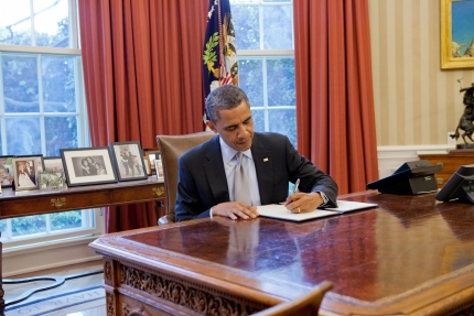 President Barack Obama signs a proclamation regarding the establishment of the Fort Ord National 