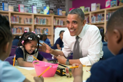 President Barack Obama participates in a literacy lesson with children while visiting a pre-kindergarten classroom