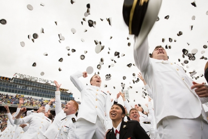 Graduates toss hats in the air at conclusion of U.S. Naval Academy commencement