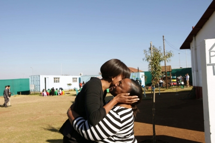 First Lady Michelle Obama is greeted in Soweto