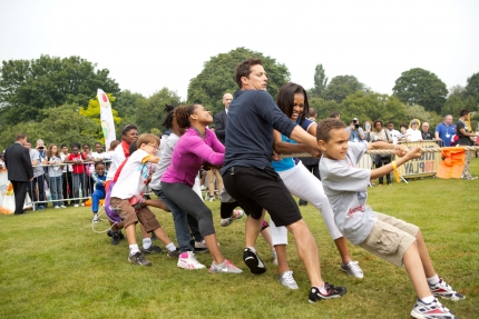 Mrs. Obama Participates In A Tug Of War
