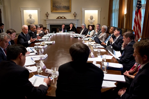 President Barack Obama listens as Vice President Joe Biden presents proposals