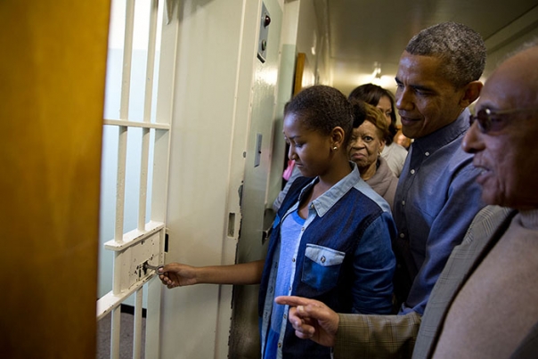 President Obama Watches as Sasha Obama Unlocks the Door