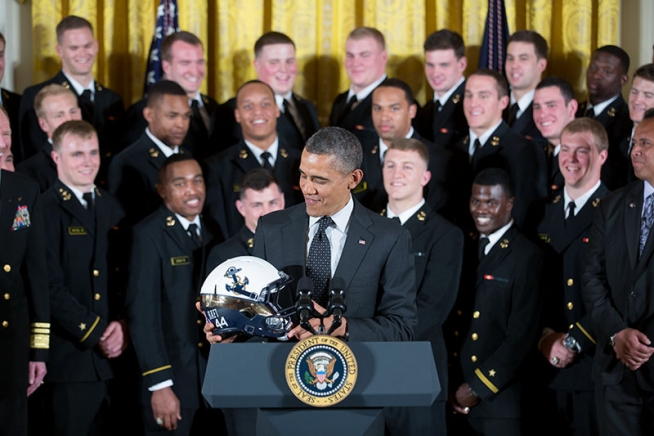 president-barack-obama-examines-the-helmet-given-to-him-by-the-united