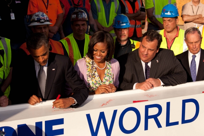 President Barack Obama signs a steel beam at the One World Trade Center ...