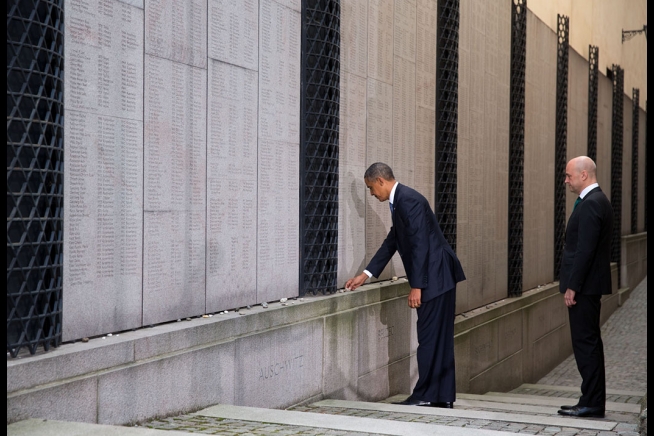 President Barack Obama And Swedish Prime Minister Fredrik Reinfeldt Place Stones And Pause For A