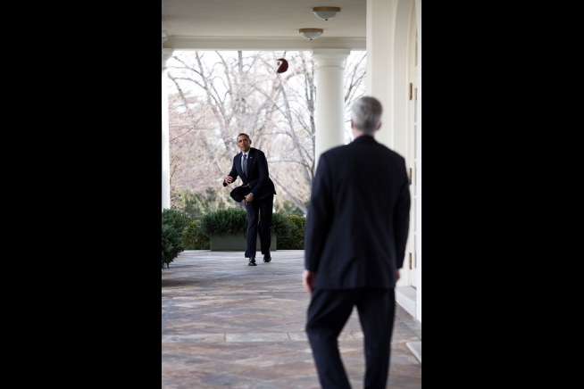 President Barack Obama throws a football with Chief of Staff Denis ...