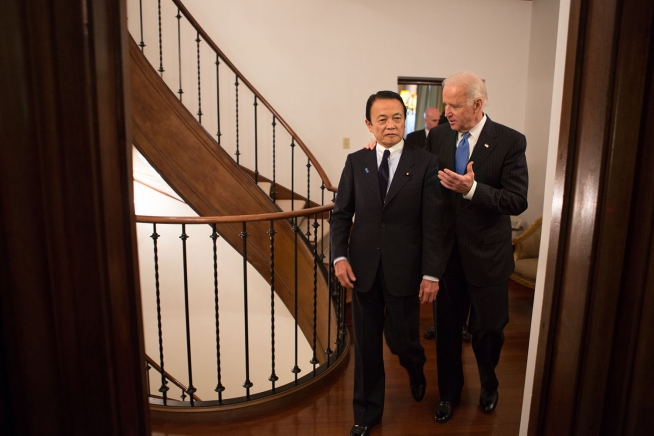 Vice President Joe Biden walks with Japanese Deputy Prime Minister Taro Aso, at the U.S. Ambassador's residence, in Tokyo, Japan, Dec. 3, 2013. (Official White House Photo by David Lienemann)