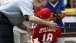 George W. Bush presents Angel Tavarez with a baseball