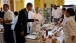 President Barack Obama samples a baked zucchini fry in the Old Family Dining Room