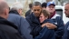 President Barack Obama hugs Donna Vanzant, the owner of North Point Marina